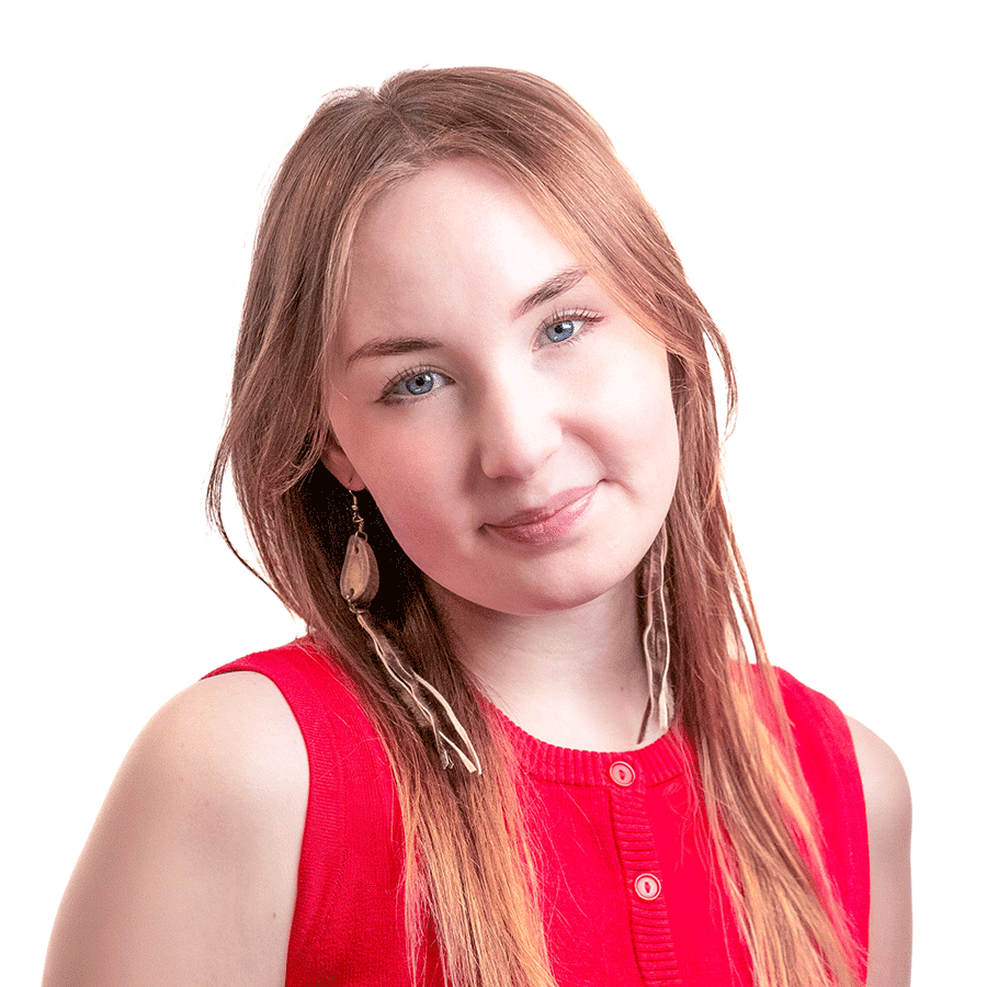 Head-and-shoulders portrait of a person with long, straight light brown hair and blue eyes, facing the camera with a slight tilt of her head and a soft, neutral smile. She is wearing a sleeveless red top with small buttons at the neckline and long, dangling earrings with natural feather-like details. The background is plain white, and the lighting is soft and even, creating a clean professional studio-style image.