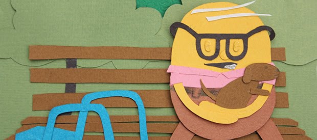 Old Man On A Bench With A Puppy